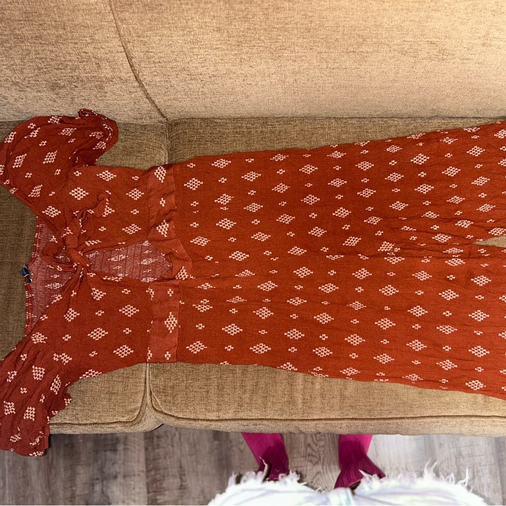 Elegant Rust Jumpsuit with Patterned Design